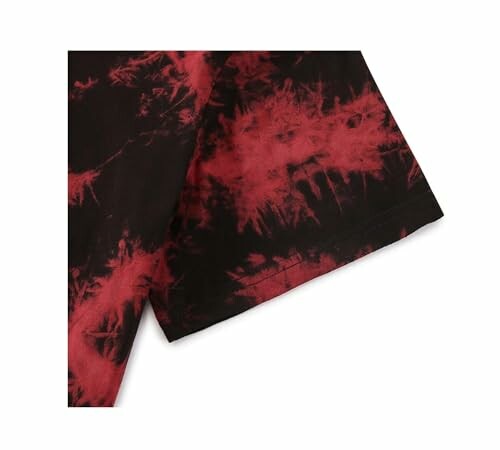 Close-up of a red and black tie-dye shirt sleeve